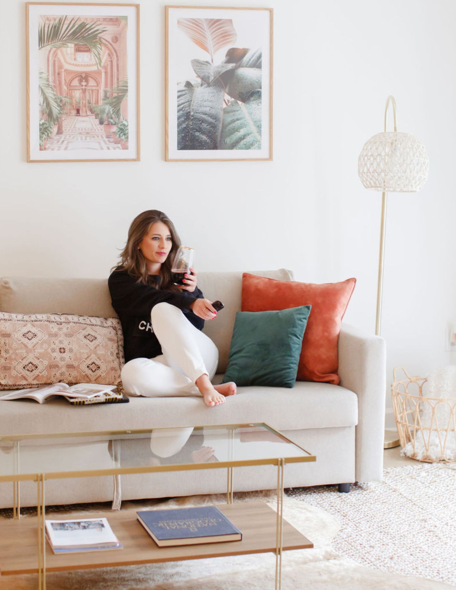 Jamie Milam woman relaxing with glass of wine and tv