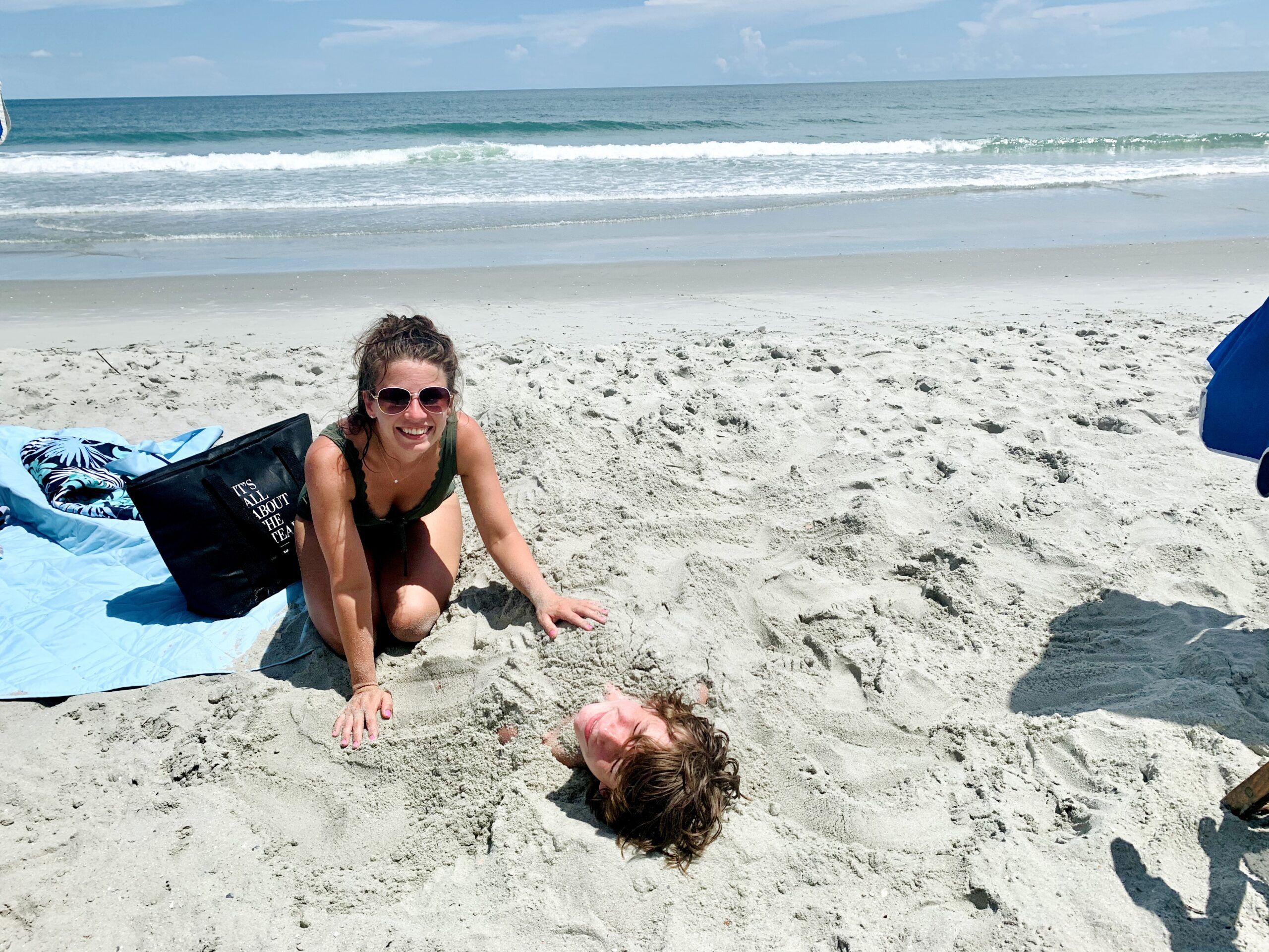 Mother and son playing in the sand at Myrtle Beach