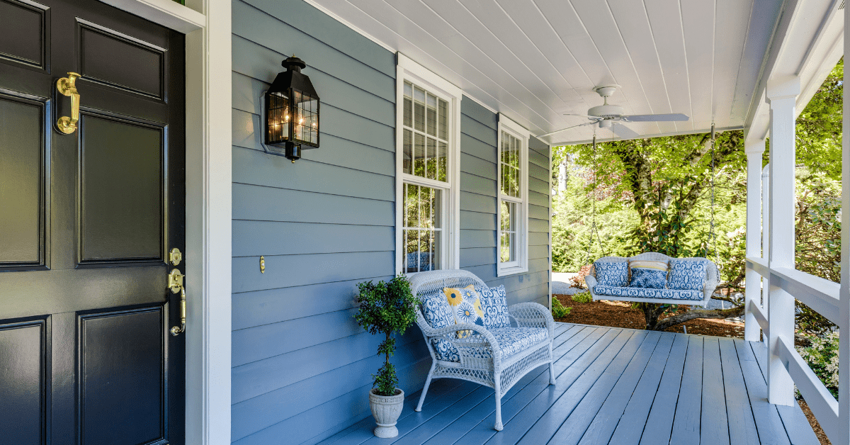 A front patio of a house during summer time