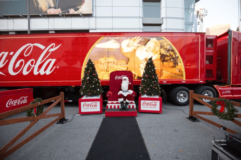 Santa in front of a Coca-Cola display at the Holiday Uptown Market in Charlotte