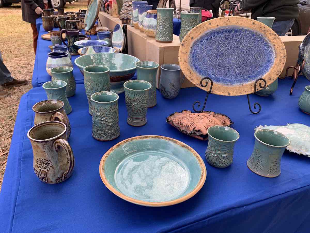 Pottery displayed on a table at the NoDa Pottery Market