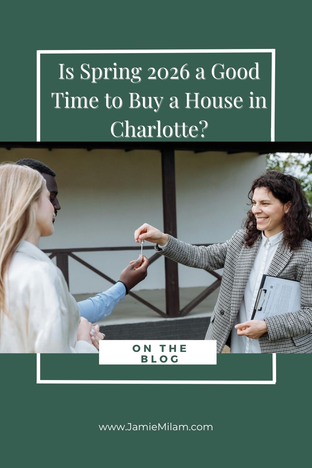 A real estate agent handing keys to a couple who bought a new house