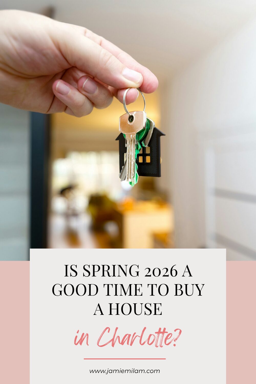 Someone holding up a set of keys to their new house and the text "Is Spring 2026 a Good Time to Buy a House in Charlotte?"