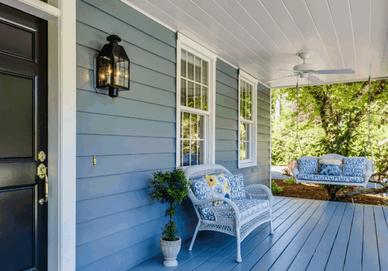 A front patio of a house during summer time